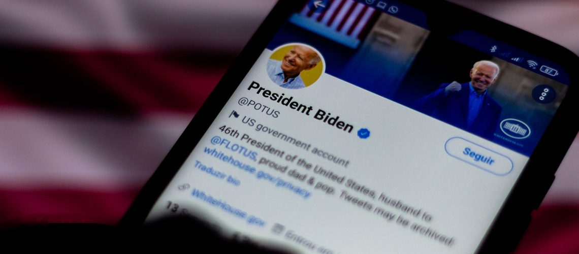 A cell phone showing President Biden's Twitter page